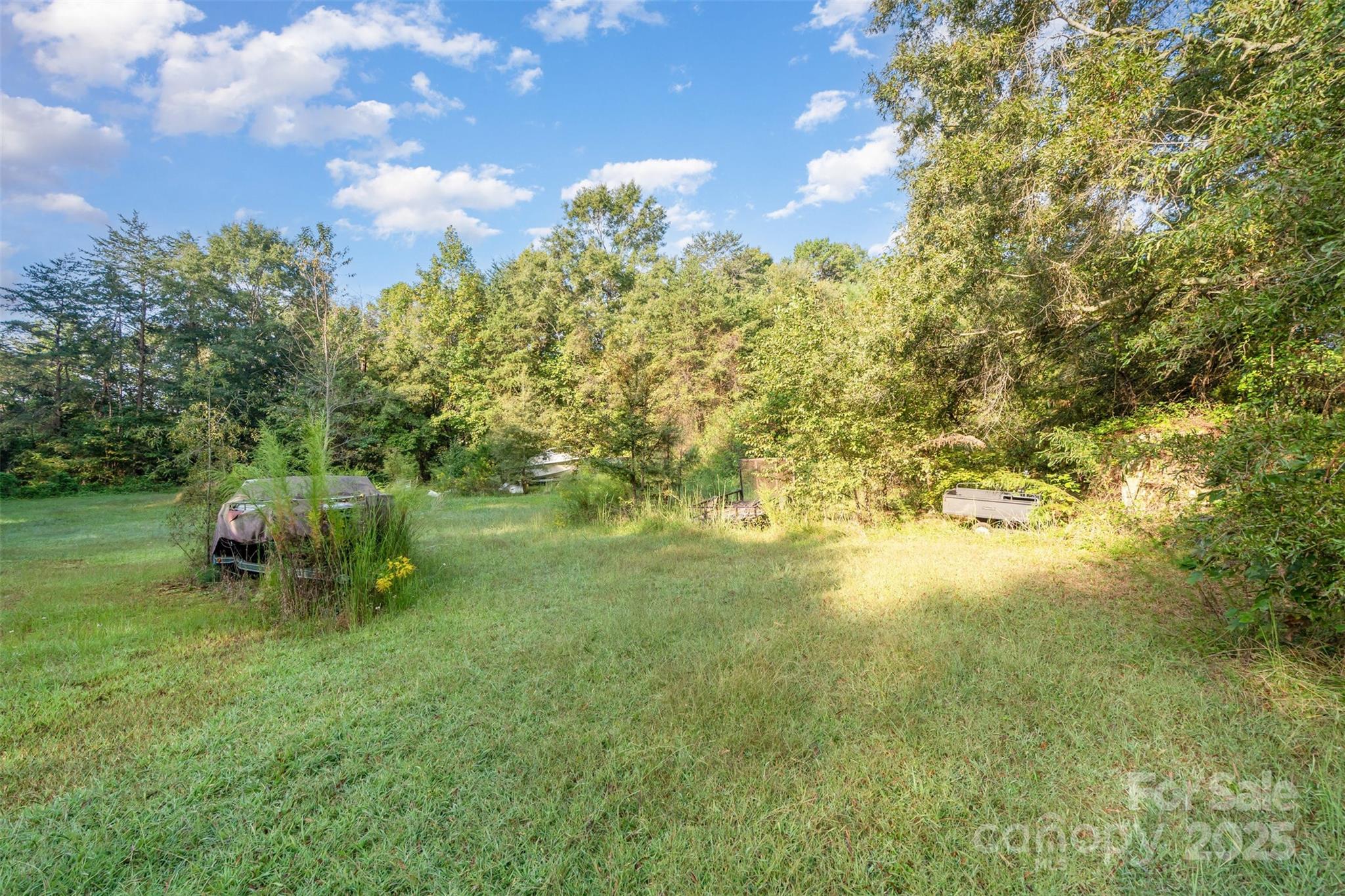 3164 Andrew Link Road Iron Station, NC 28080 - Photo 5 of 17 a backyard of a house with table and chairs