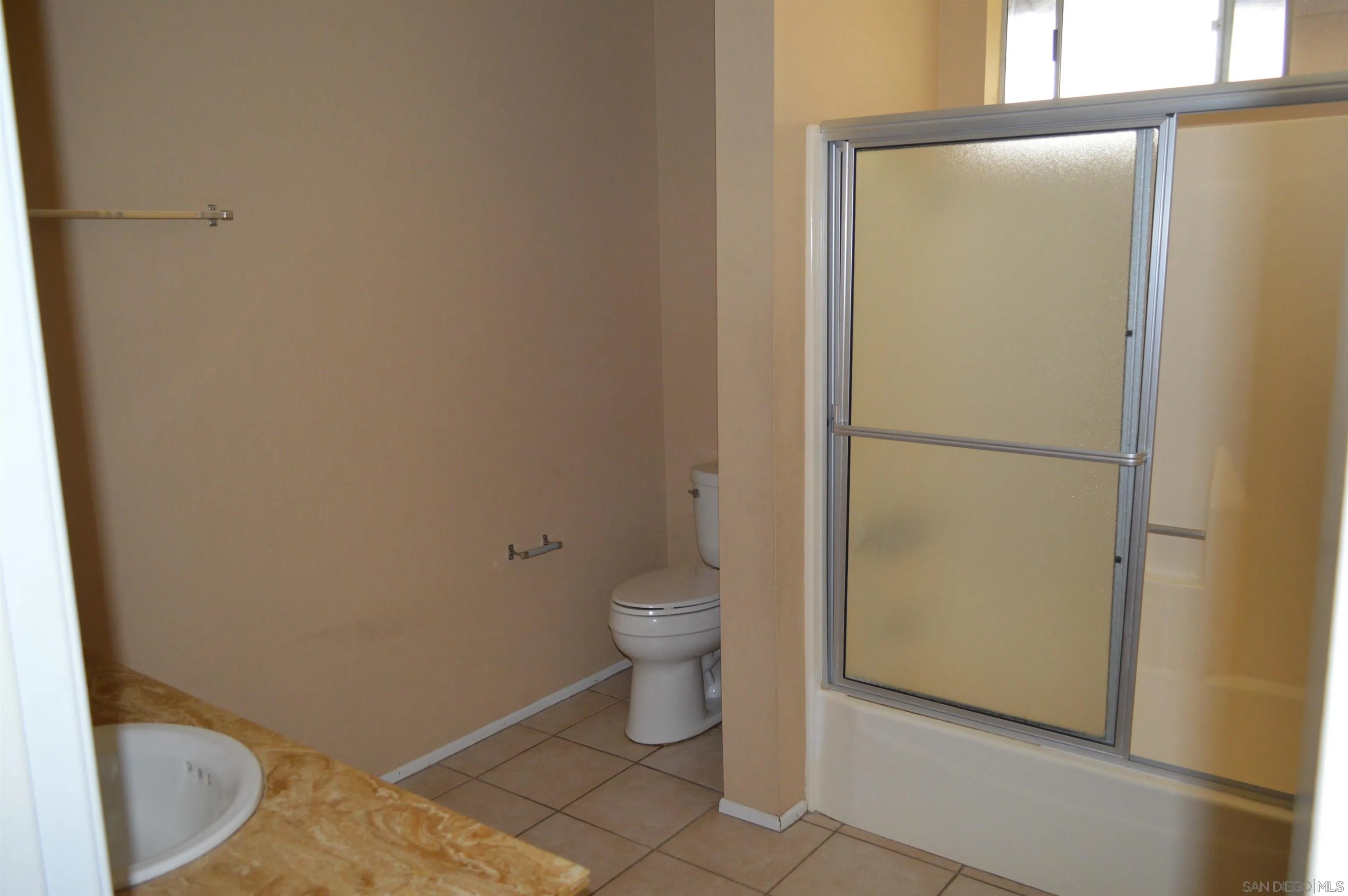13353 Sutter Mill Road Poway, CA 92064 - Photo 14 of 14 a bathroom with a granite countertop toilet and a sink