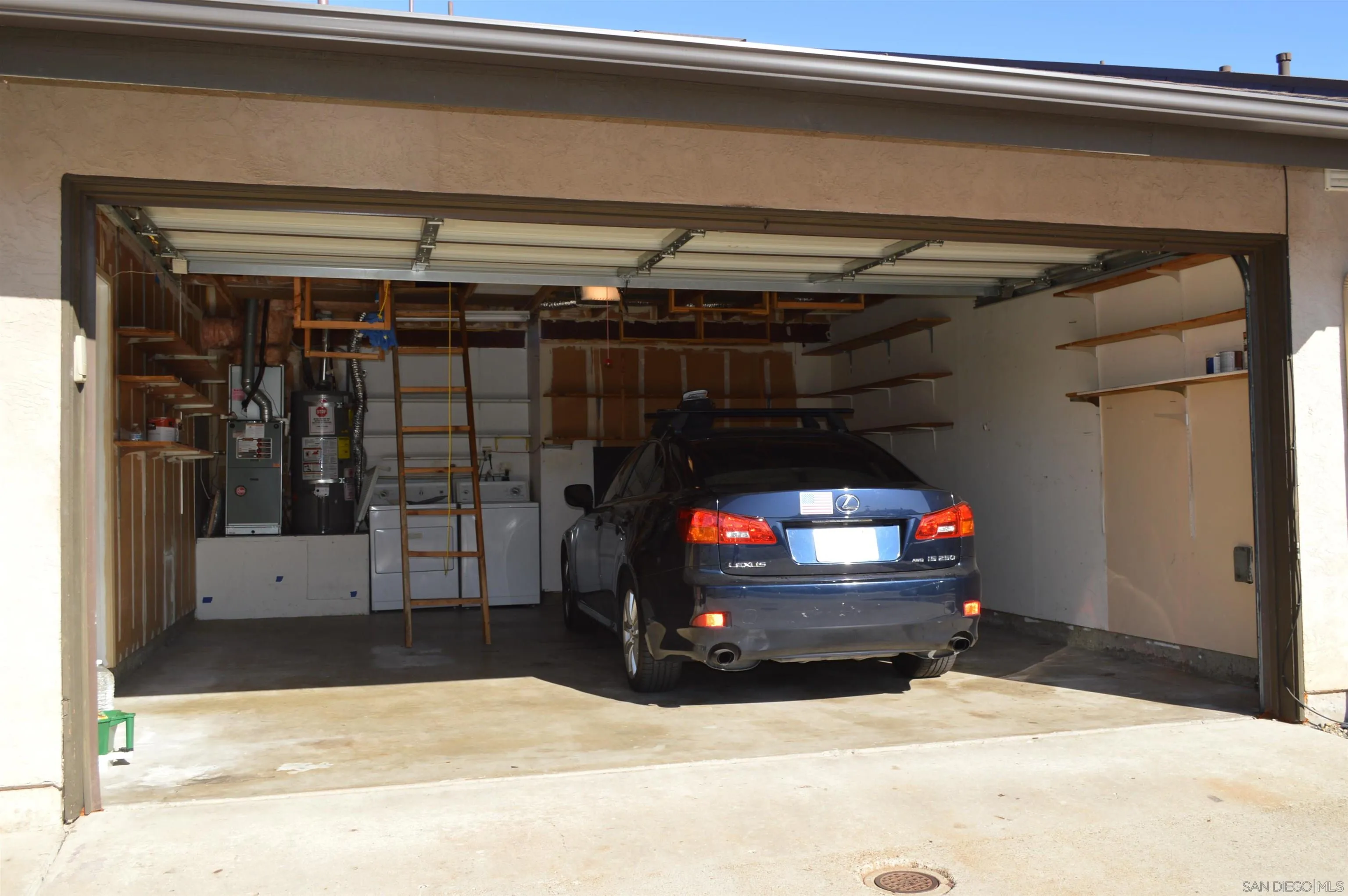 13353 Sutter Mill Road Poway, CA 92064 - Photo 3 of 14 a view of car parked in garage