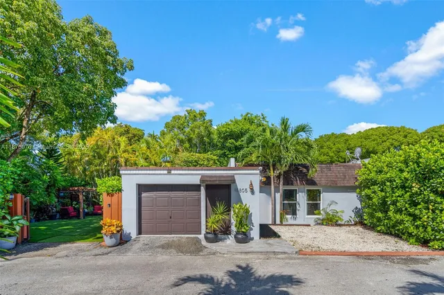 front view of a house with a garden