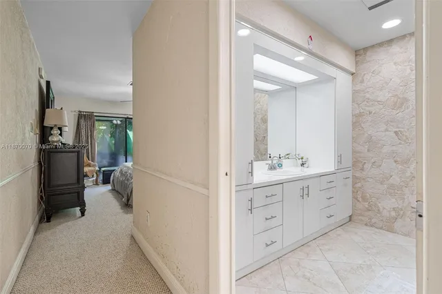 a bathroom with a double vanity sink and mirror