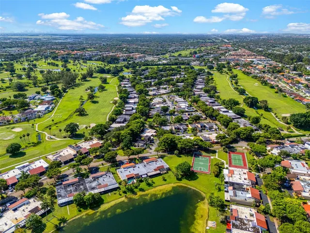 a view of a swimming pool with a table and chairs