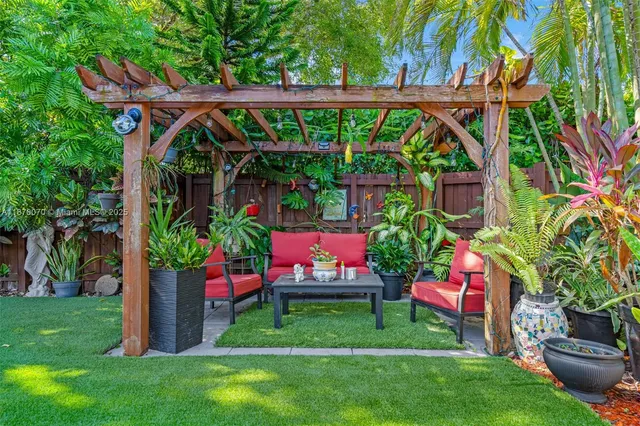 a view of yard with deck and seating space