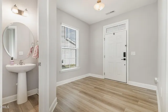 a view of a bathroom with sink and mirror