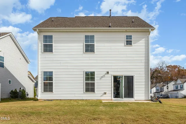 a front view of a house with a swimming pool