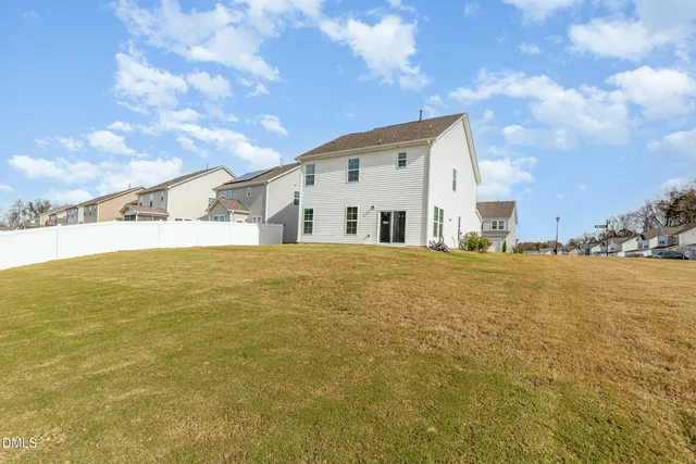 a large white house with a large pool
