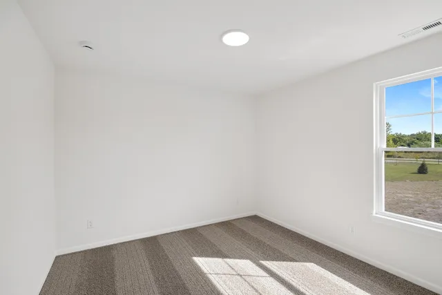 a view of an empty room and window