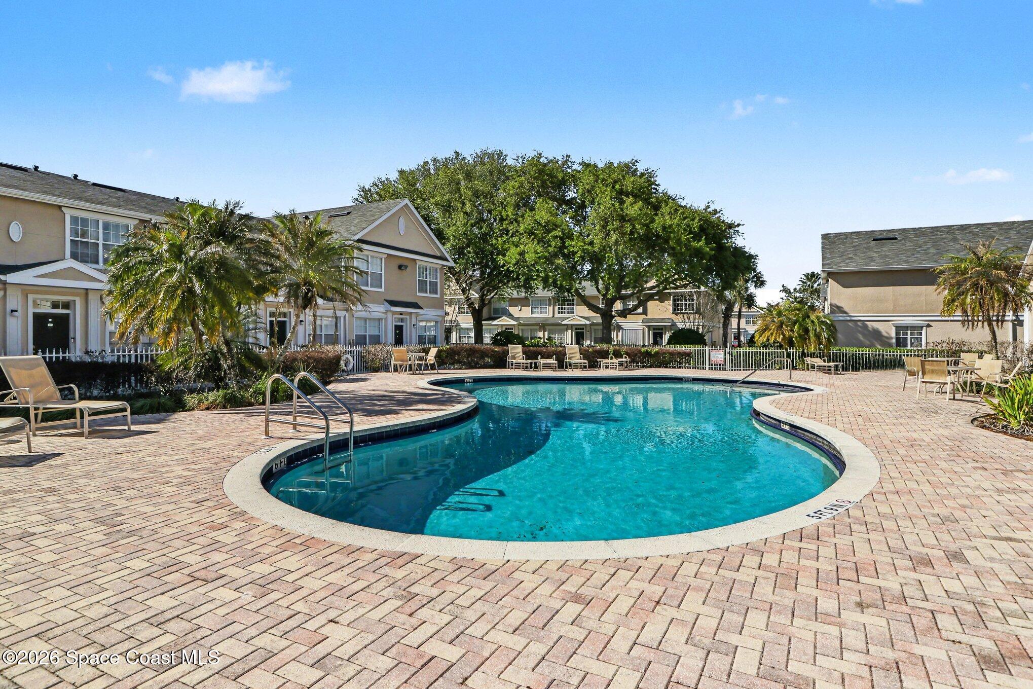 3955 Almeida Court, Unit 103 Melbourne, FL 32901 - Photo 26 of 32 a view of outdoor space yard swimming pool and patio