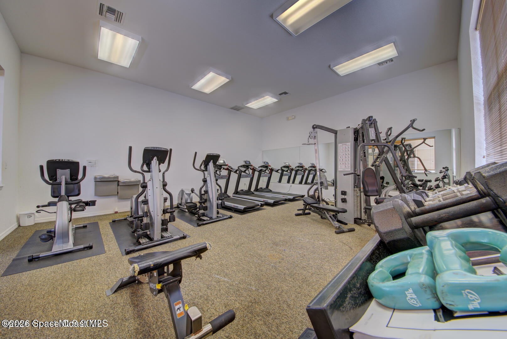 3955 Almeida Court, Unit 103 Melbourne, FL 32901 - Photo 29 of 32 a view of a room with gym equipment