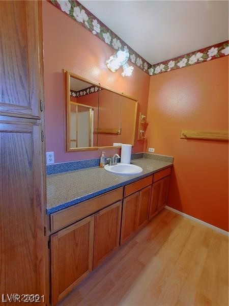 630 East Simkins Road Pahrump, NV 89060 - Photo 12 of 50 Bathroom with vanity and light wood-style flooring