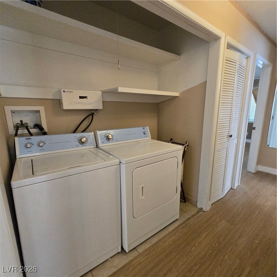 630 East Simkins Road Pahrump, NV 89060 - Photo 48 of 50 Laundry room featuring light wood-style flooring and washer and dryer