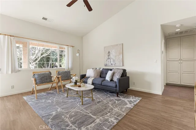 a living room with furniture and a window