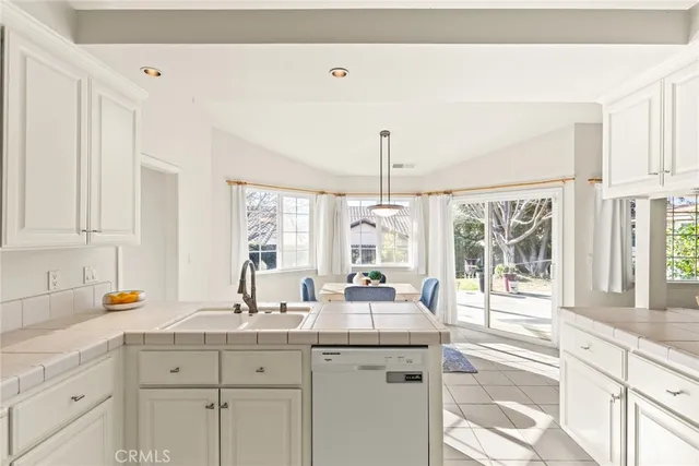 a view of a kitchen with electric appliances