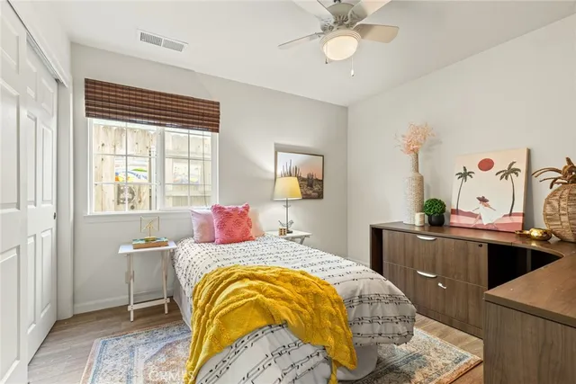 a bedroom with a bed and a table