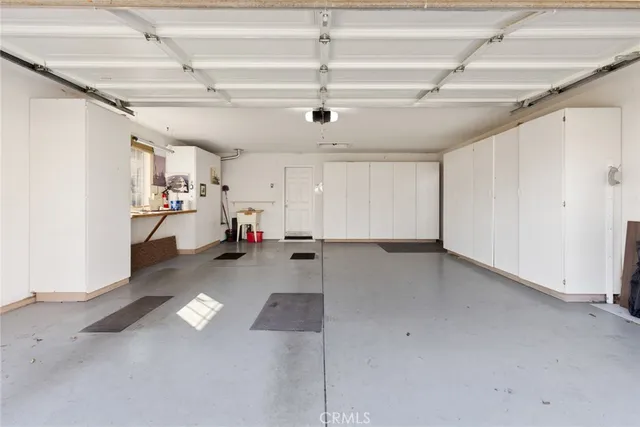 a view of a house with backyard sitting area and garden