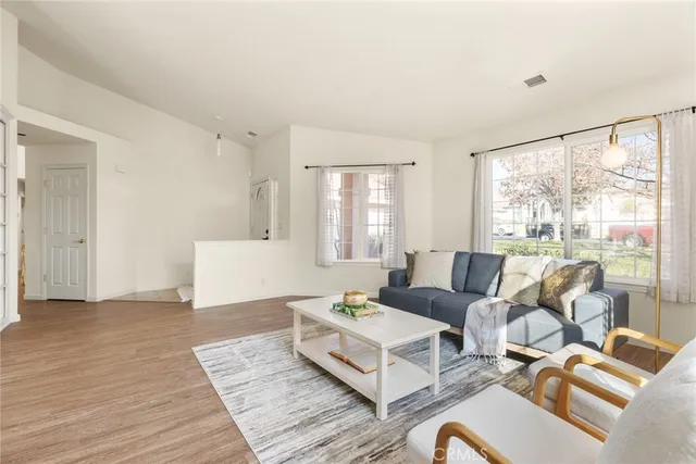 a living room with furniture and a large window