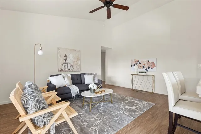 a living room with furniture and a table