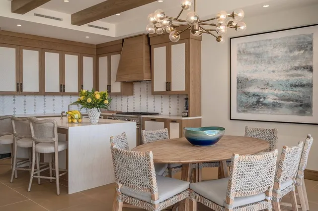 a kitchen with a table and chairs