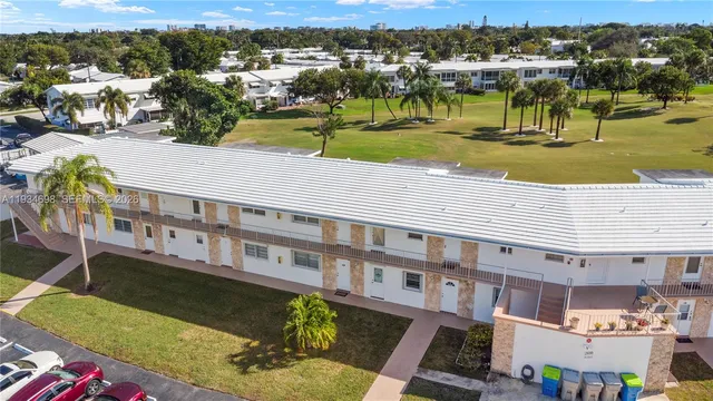 an aerial view of a house with a swimming pool