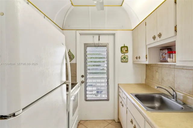 a bathroom with a sink a vanity and a shower