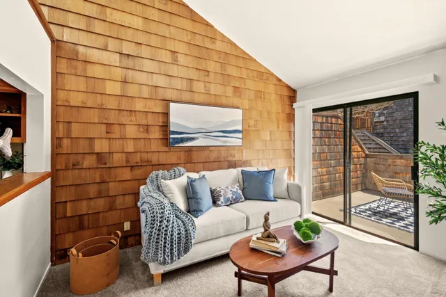 a living room with furniture and a rug