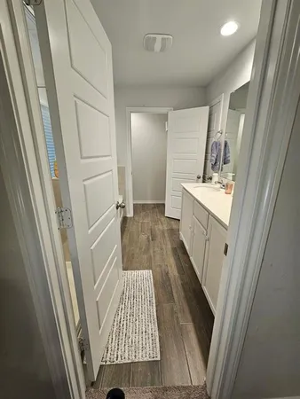 a bathroom with a sink a bathtub and a shower