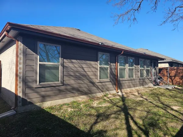 a house with trees in the background