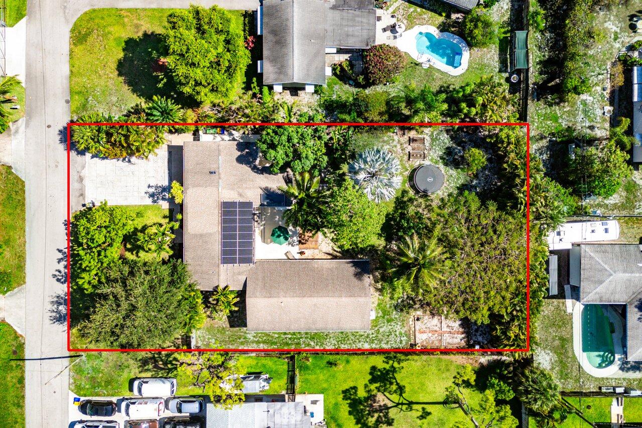 3064 Rostan Lane Palm Springs, FL 33461 - Photo 1 of 49 an aerial view of a house