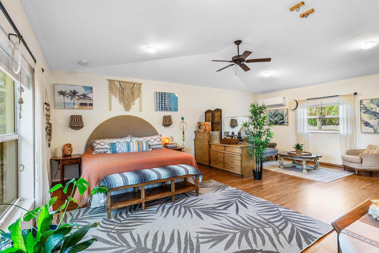 3064 Rostan Lane Palm Springs, FL 33461 - Photo 13 of 49 a bedroom with furniture and a window