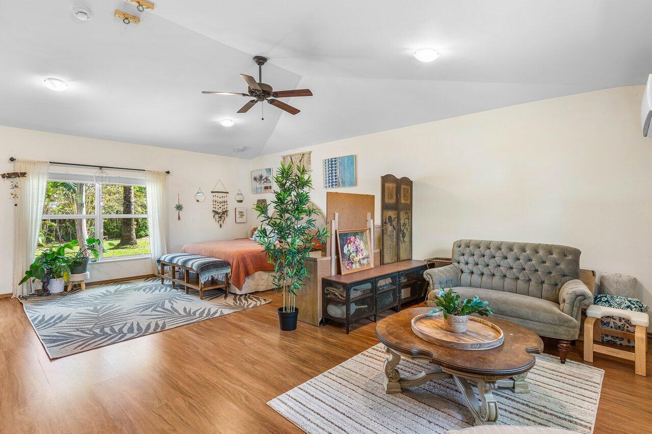 3064 Rostan Lane Palm Springs, FL 33461 - Photo 15 of 49 a living room with furniture and a wooden floor