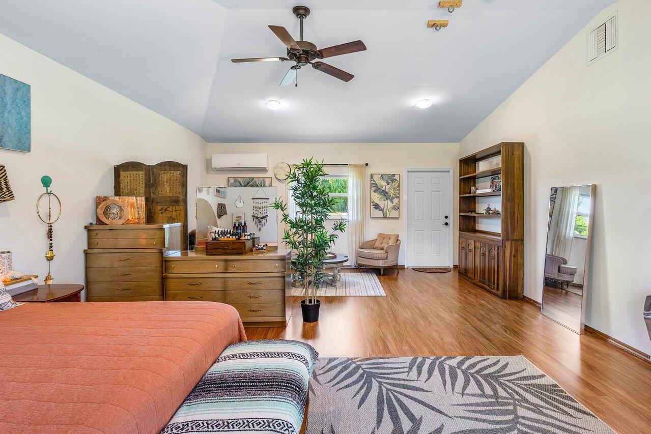3064 Rostan Lane Palm Springs, FL 33461 - Photo 16 of 49 a living room with furniture and wooden floor