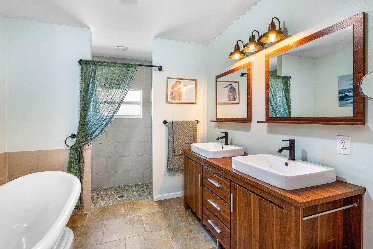 3064 Rostan Lane Palm Springs, FL 33461 - Photo 20 of 49 a bathroom with a sink and a mirror