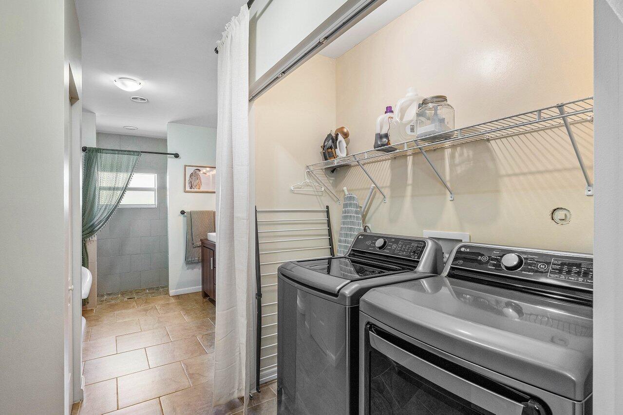 3064 Rostan Lane Palm Springs, FL 33461 - Photo 22 of 49 a kitchen with a stove and a refrigerator