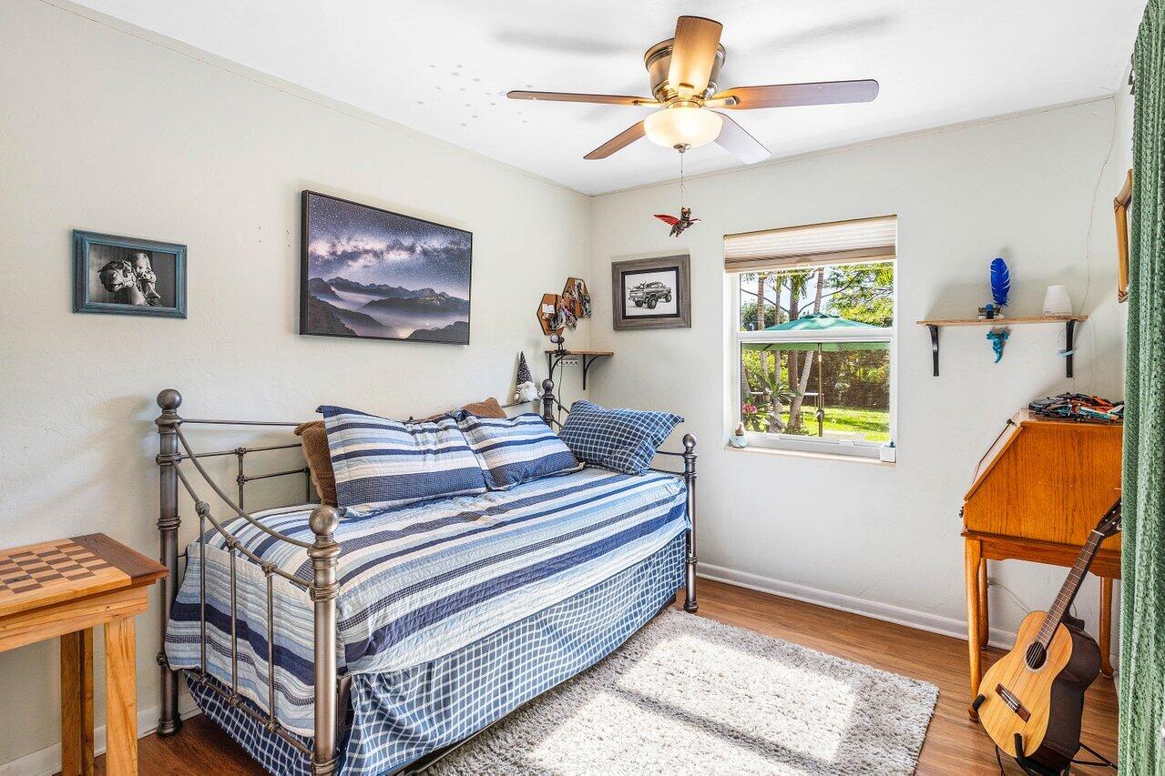 3064 Rostan Lane Palm Springs, FL 33461 - Photo 31 of 49 a bedroom with a bed and a window
