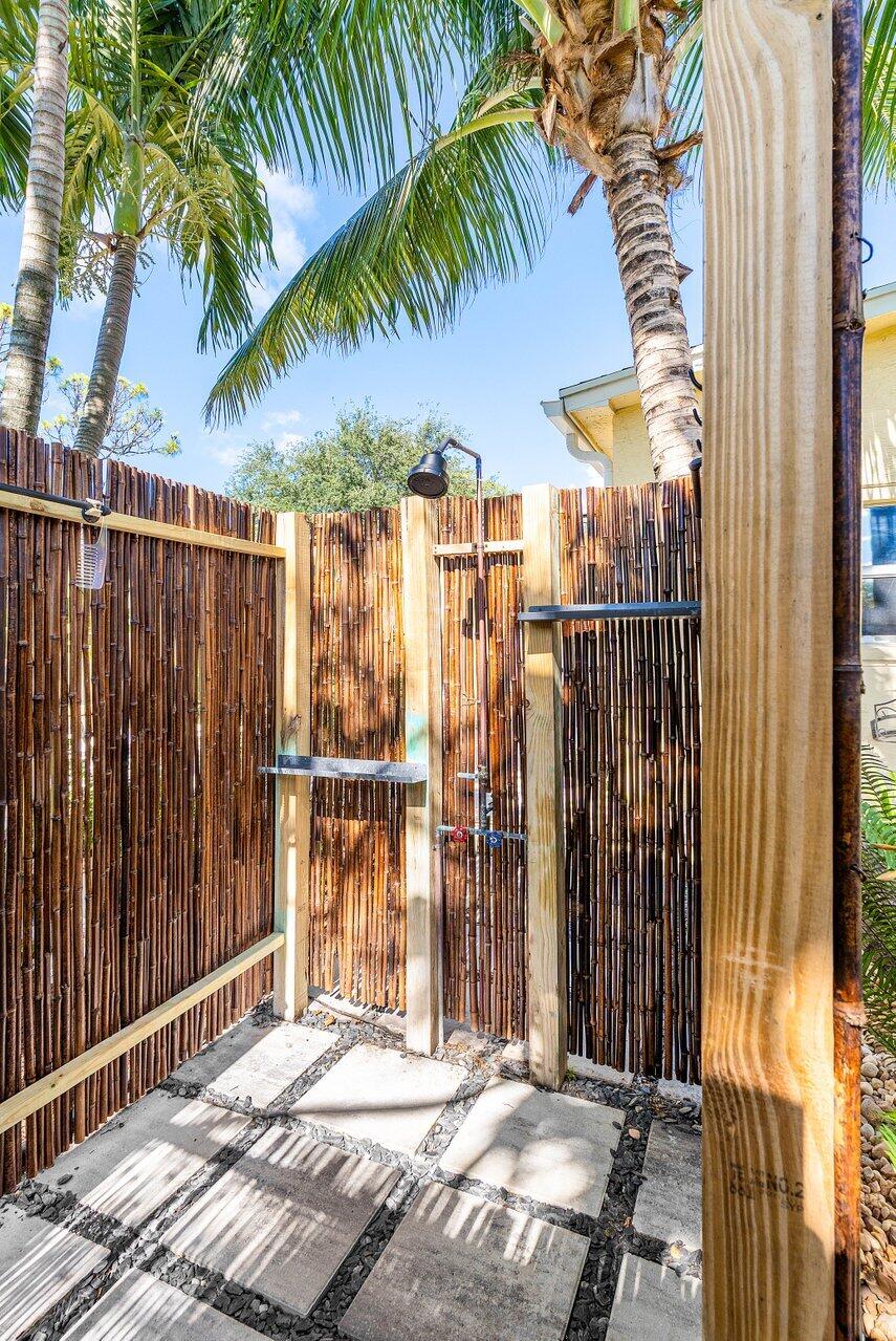 3064 Rostan Lane Palm Springs, FL 33461 - Photo 37 of 49 a backyard of a house with swimming pool in the back