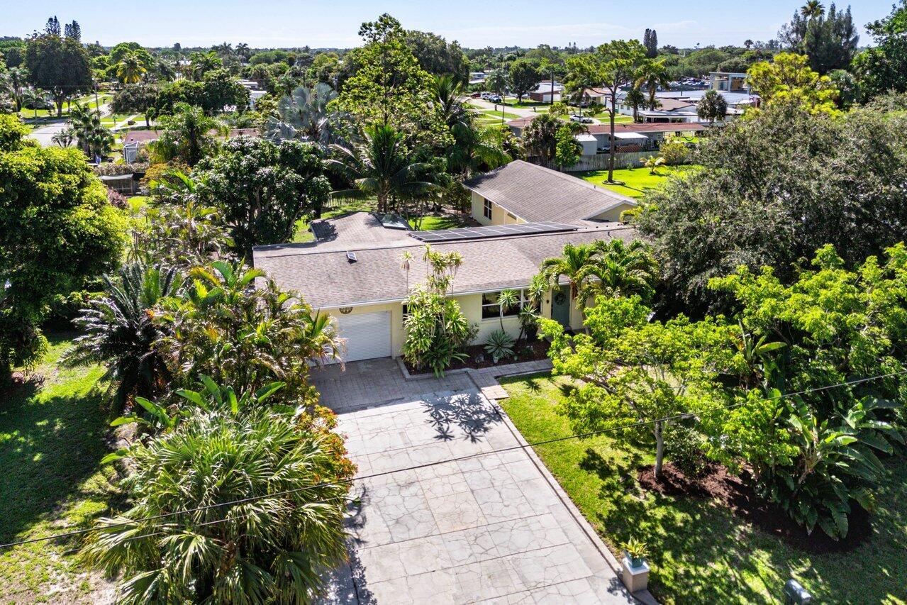 3064 Rostan Lane Palm Springs, FL 33461 - Photo 42 of 49 an aerial view of a house with a yard basket ball court and outdoor seating
