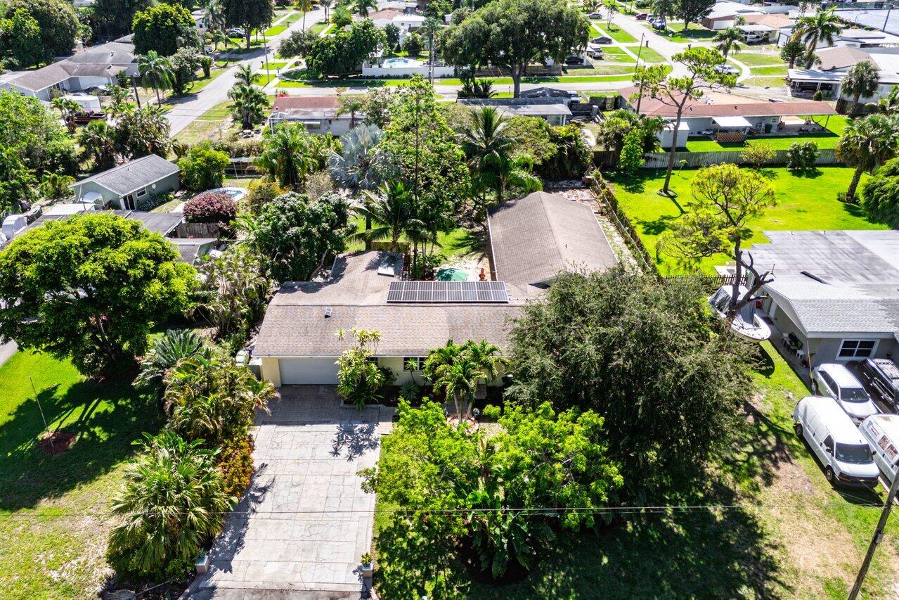3064 Rostan Lane Palm Springs, FL 33461 - Photo 44 of 49 an aerial view of a house with a garden and swimming pool