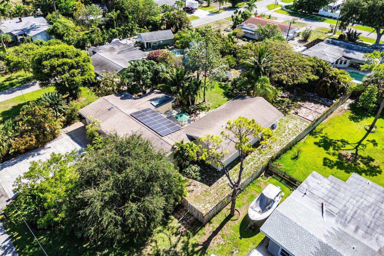 3064 Rostan Lane Palm Springs, FL 33461 - Photo 46 of 49 an aerial view of a house with a yard and garden