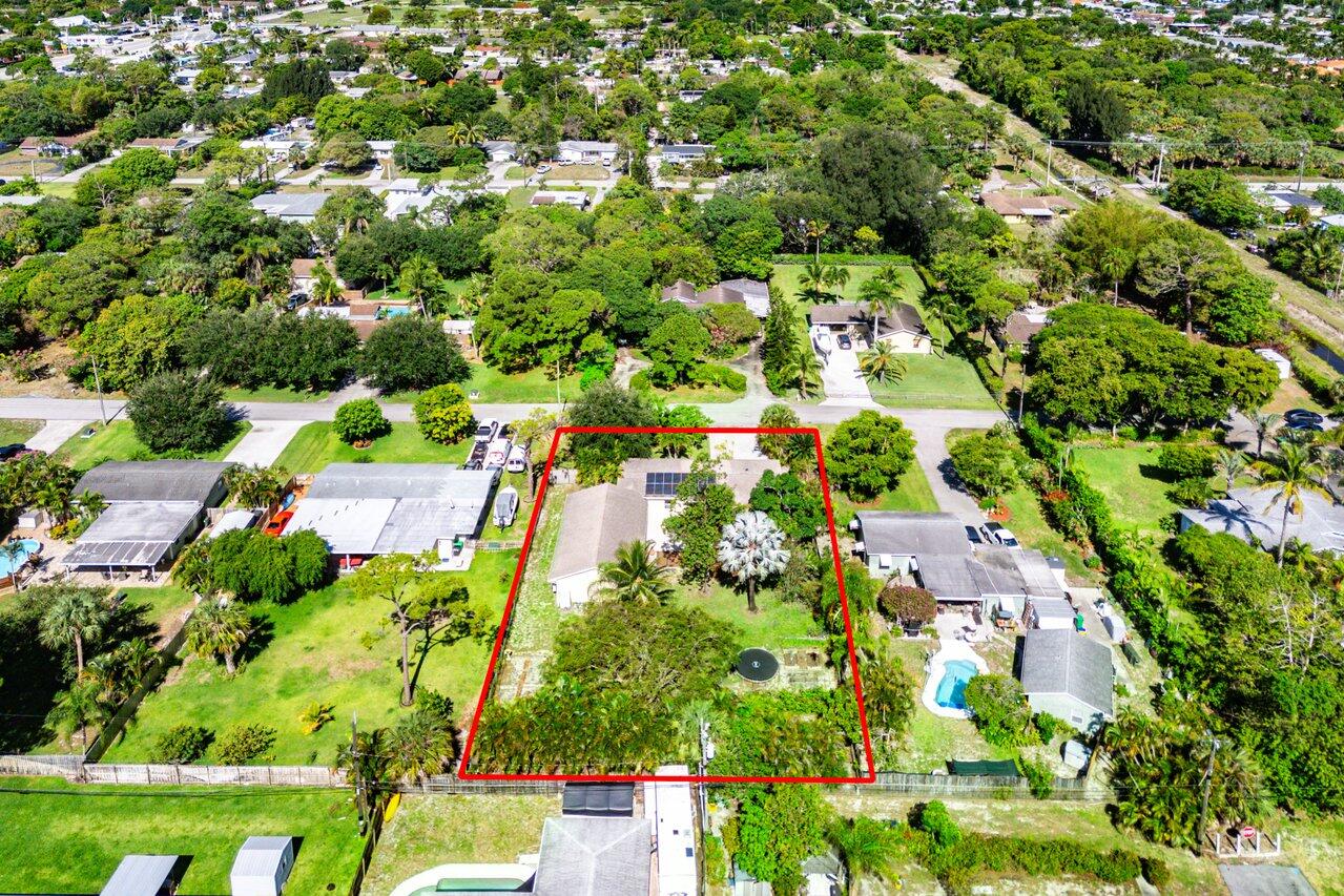 3064 Rostan Lane Palm Springs, FL 33461 - Photo 49 of 49 an aerial view of residential houses with outdoor space