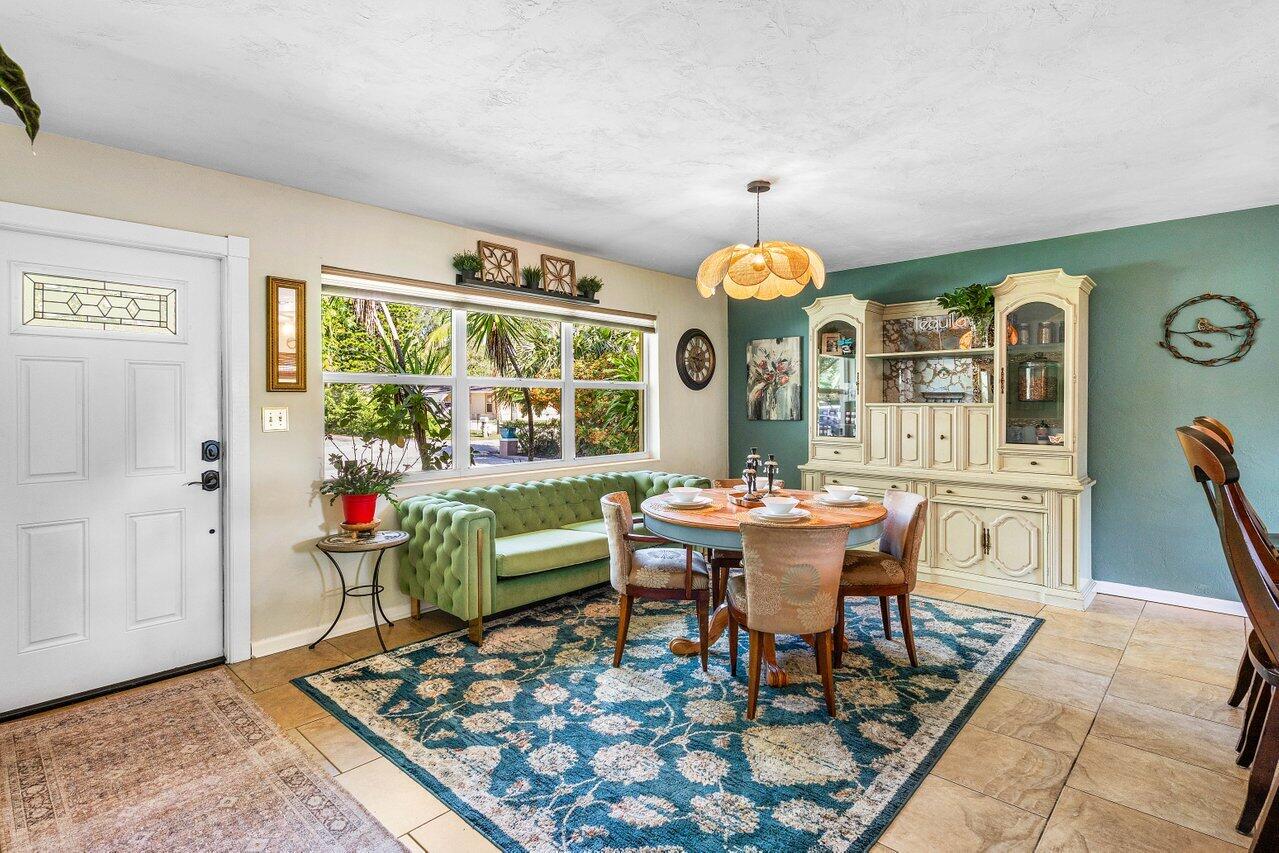 3064 Rostan Lane Palm Springs, FL 33461 - Photo 6 of 49 a view of a dining room with furniture and chandelier