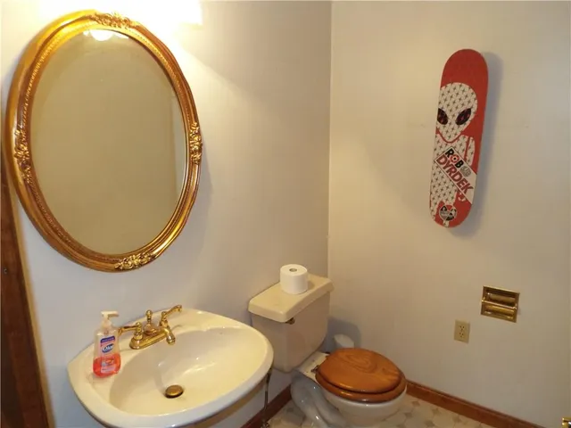a bathroom with a toilet and a sink