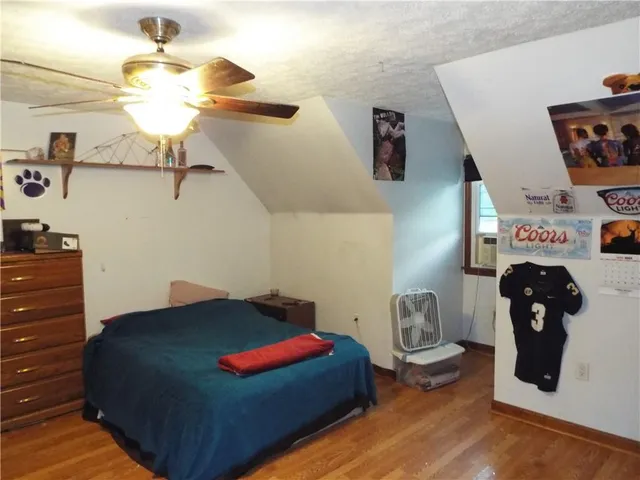 a bedroom with a bed and cabinets