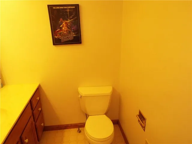 a bathroom with a toilet and a sink