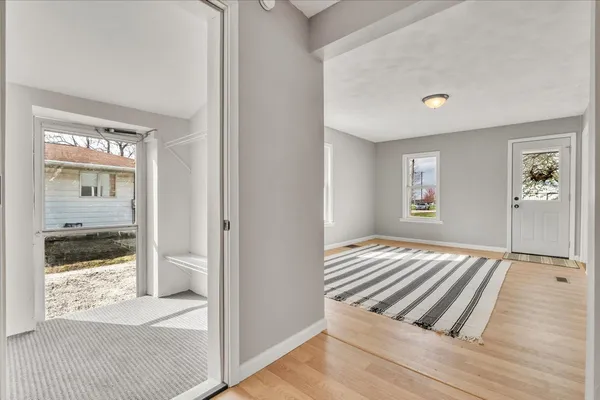 a view of a room with wooden floor and bedroom