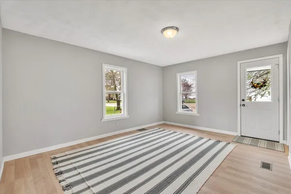 a bedroom with bed and window
