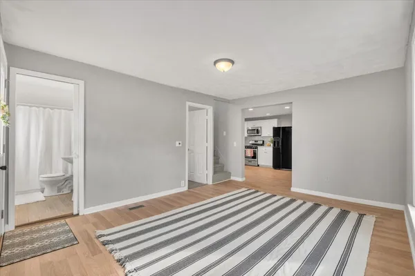 a bedroom with a bed and a walk in closet