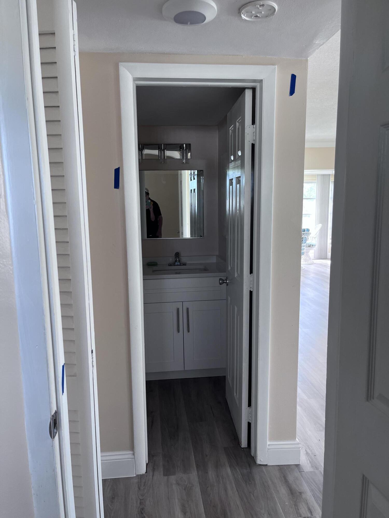 251 South Golf Boulevard, Unit 294 Pompano Beach, FL 33064 - Photo 11 of 36 a view of a hallway and wooden floor