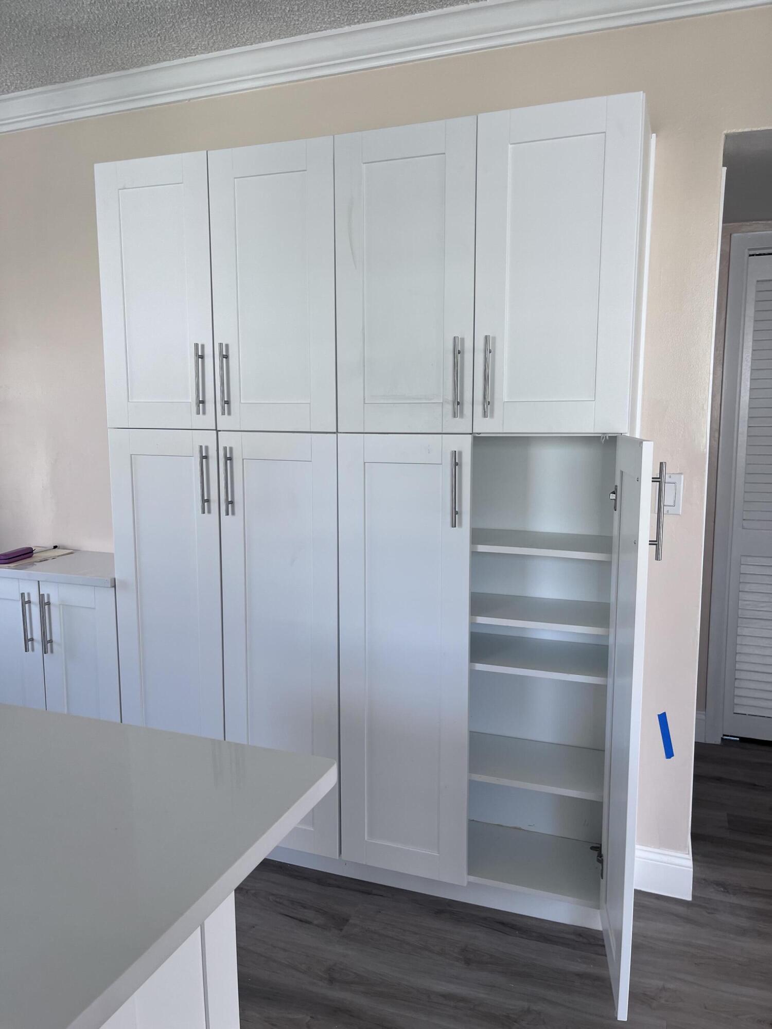 251 South Golf Boulevard, Unit 294 Pompano Beach, FL 33064 - Photo 28 of 36 a view of walk in closet with empty racks