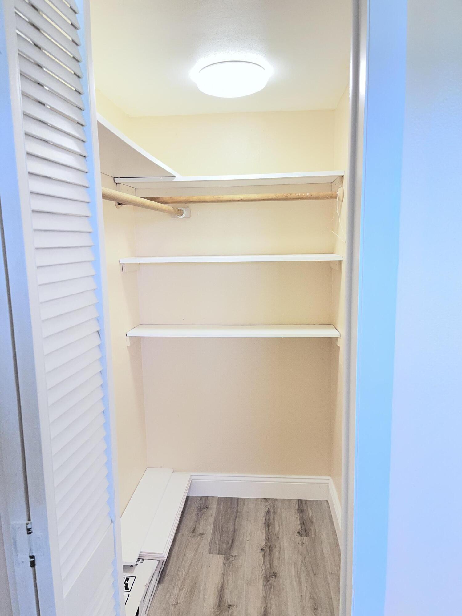 251 South Golf Boulevard, Unit 294 Pompano Beach, FL 33064 - Photo 10 of 36 a view of a room with wooden floor