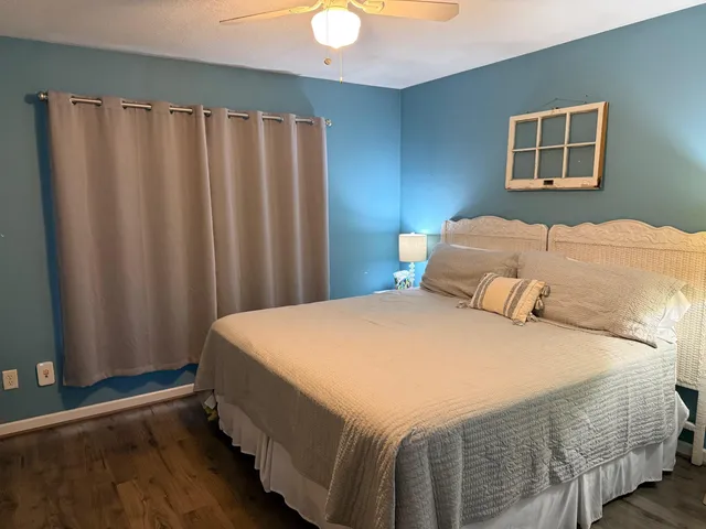 a bathroom with a sink a mirror a toilet and shower